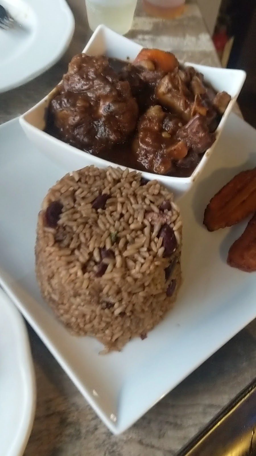 Curry goat with rice and peas